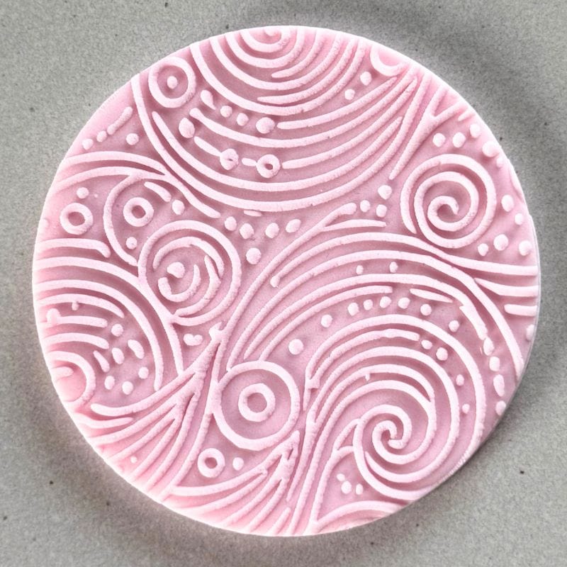 Artistic embossed fondant decoration