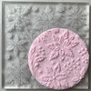 Christmas floral embosser cookie stamp with intricate floral and snowflake patterns on fondant