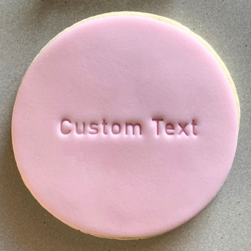 Custom text stamp on fondant cookie with straight line design