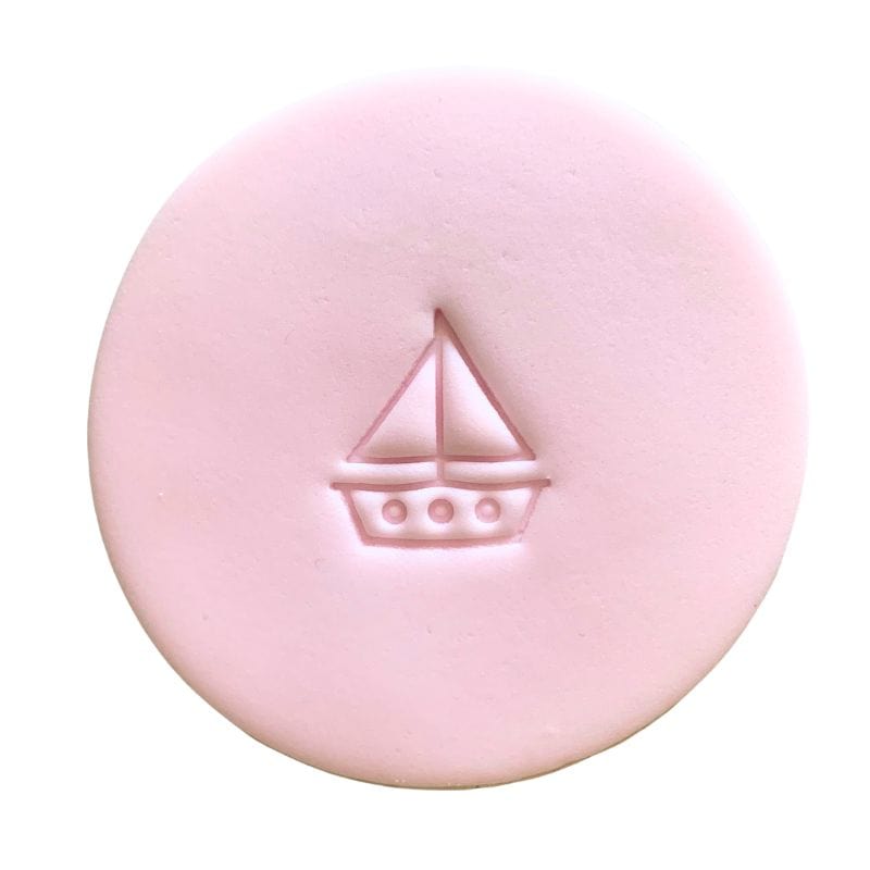 Fondant cookie with toy boat design