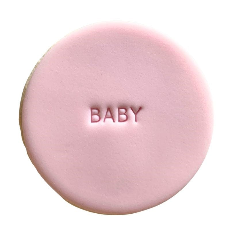 fondant cookie with "BABY" text stamp design