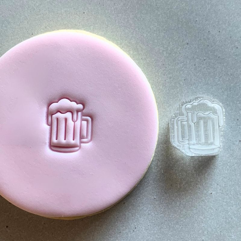 Mini Beer Cookie Stamp used to create decorated fondant cookie