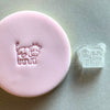 Mini Cow Cookie Stamp used to create decorated fondant cookie