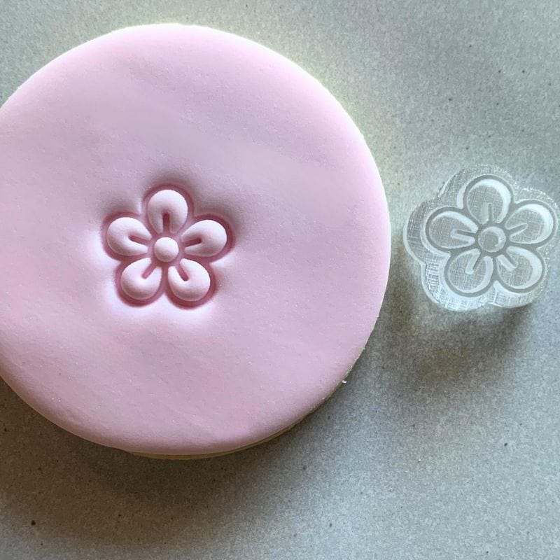 Mini Blossom Cookie Stamp used to create decorated fondant cookie