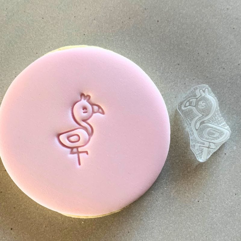 Close-up of Pixie Patio's Mini Flamingo Cookie Stamp on a cookie.