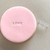 Mini Love Cookie Stamp used to create decorated fondant cookie
