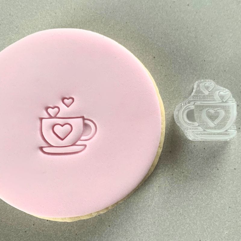 Mini Love Cup Cookie Stamp used to create decorated fondant cookie