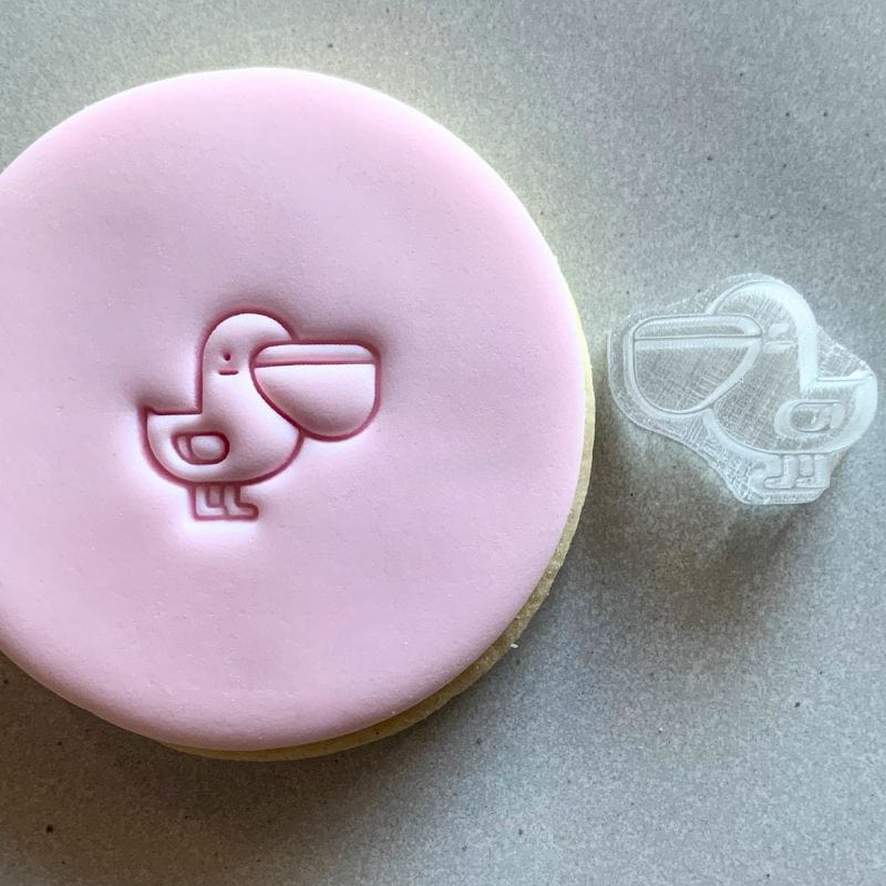 Mini Pelican Cookie Stamp used to create decorated fondant cookie.