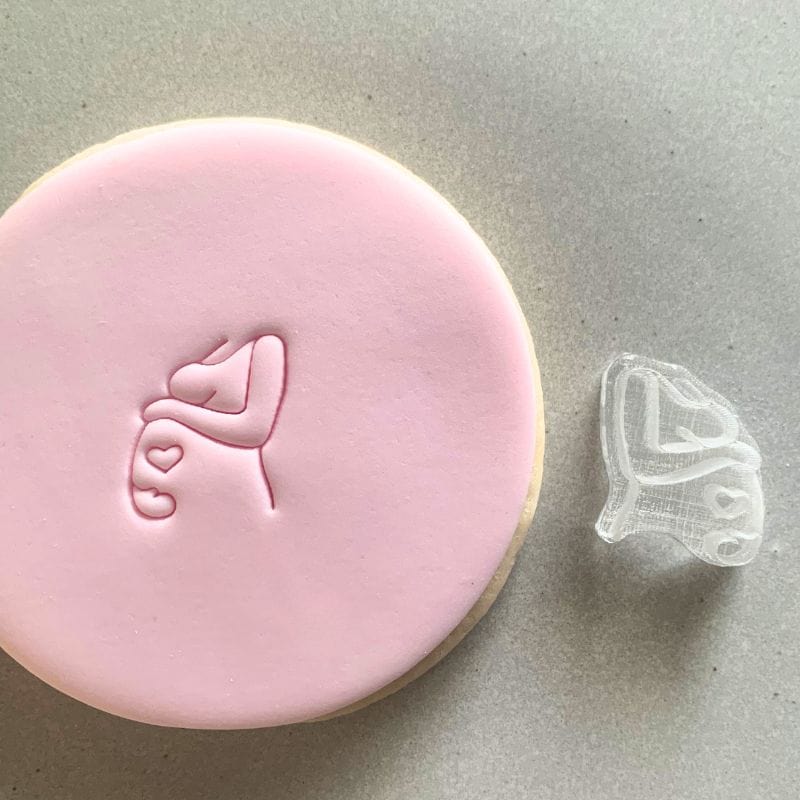 Mini Pregnant Belly Cookie Stamp used to create decorated fondant cookie