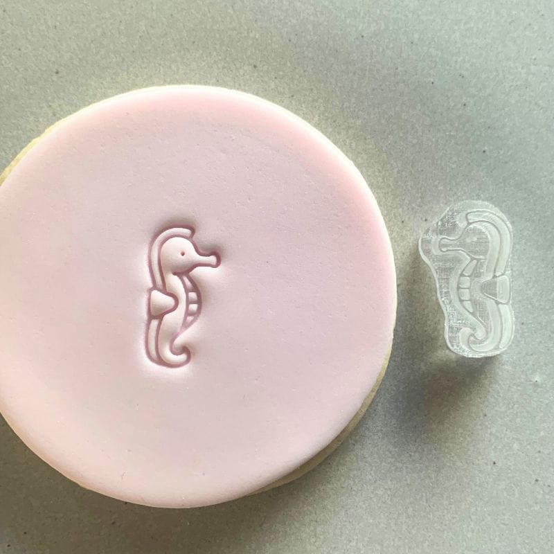 Mini Seahorse Cookie Stamp used to create decorated fondant cookie