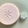 Mini Snowflake Cookie Stamp used to create decorated fondant cookie