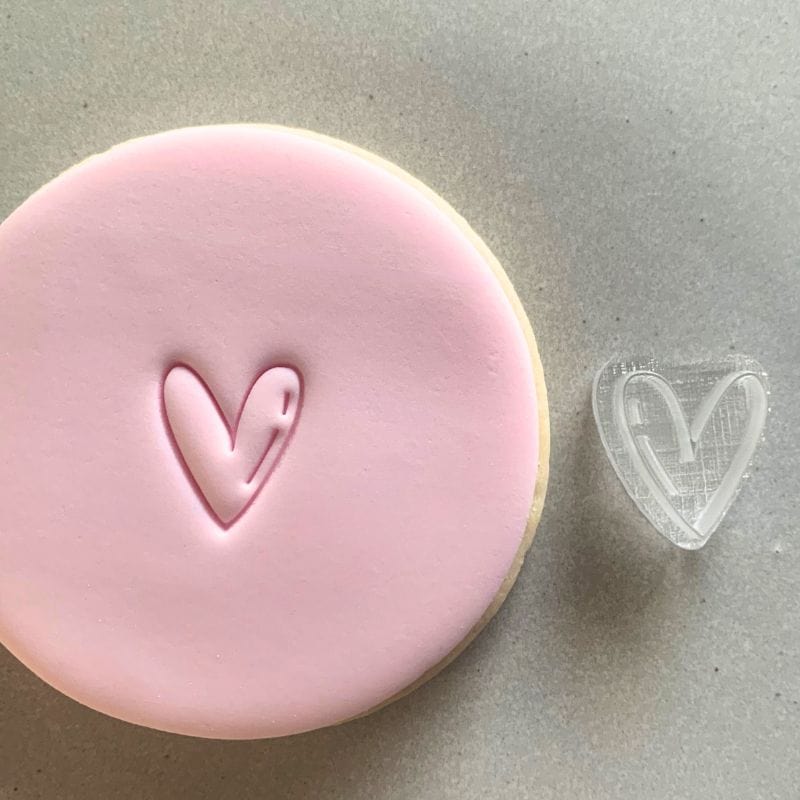 Mini Thin Heart Cookie Stamp used to create decorated fondant cookie