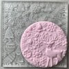 Reindeer Wonderland embosser stamp with intricate holiday details on a round fondant cookie